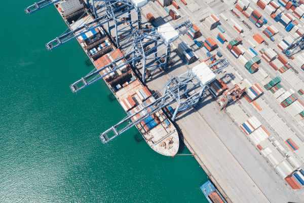 men in hi visibility jackets packing boxes